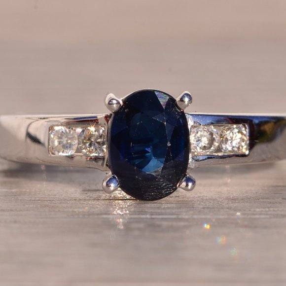 Oval Brilliant Cut Midnight Blue Sapphire and Natural Diamond Ring
